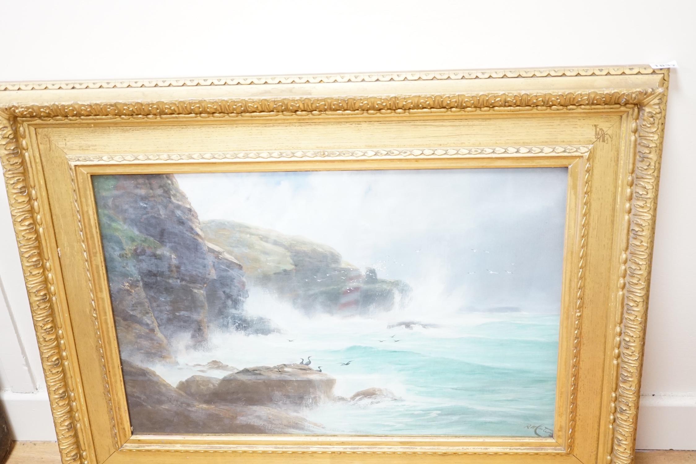 Richard Harry Carter (1839-1911), oil, Seascape with rocky cliffs, signed, 39 x 59cm. Condition - fair